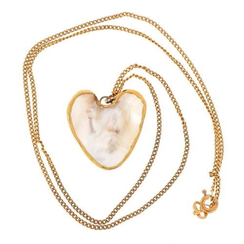 62 - 9ct gold necklace with mother of pearl heart pendant having yellow metal mount, the necklace 44cm in... 