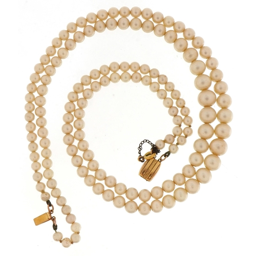 65 - Two strand graduated simulated pearl necklace with 9ct gold clasp, 44cm in length, 36.5g