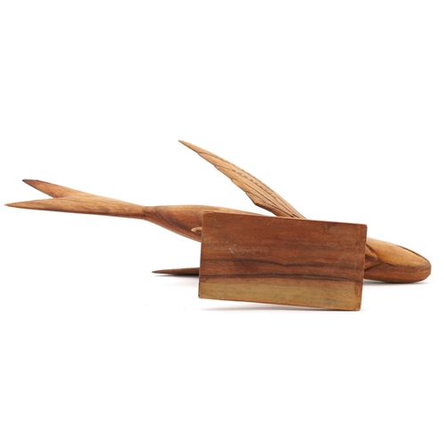 77 - Pitcairn Island carved souvenir treen flying fish made by Lancy Christian, 34.5cm in length