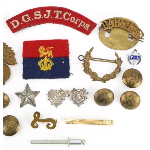 79 - Militaria including silver Royal Artillery mizpah double love heart brooch, cap badge, buttons and D... 