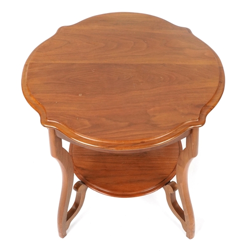 109 - Mahogany centre table with serpentine outline and under tier, 62cm high x 67cm in diameter