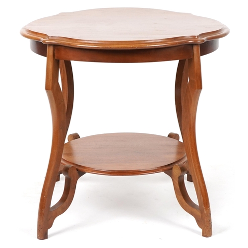 109 - Mahogany centre table with serpentine outline and under tier, 62cm high x 67cm in diameter