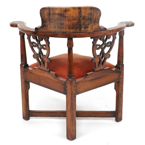 50 - 19th century country style corner chair carved with lion crest and flowers, 80cm high