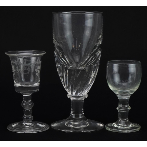 282 - Three 18th century and later glasses including one with folded foot etched with berries, the largest... 
