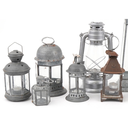 2355 - Collection of metal hanging lanterns and tealight holders, the largest 48cm high