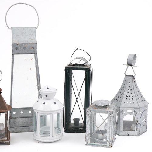 2355 - Collection of metal hanging lanterns and tealight holders, the largest 48cm high