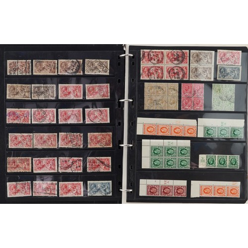 41 - British George V stamps arranged in an album including Seahorses up to ten shillings, blocks and con... 