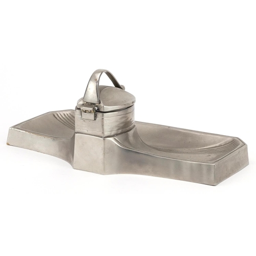 325 - Manner of WMF, Art Nouveau style pewter inkwell with ceramic liner, 25.5cm wide