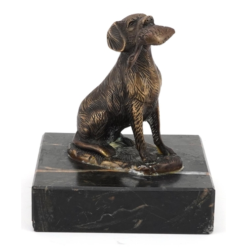 2312 - Patinated bronze seated gun dog with game raised on a square marble base, 17.5cm high