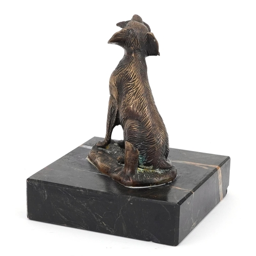 2312 - Patinated bronze seated gun dog with game raised on a square marble base, 17.5cm high