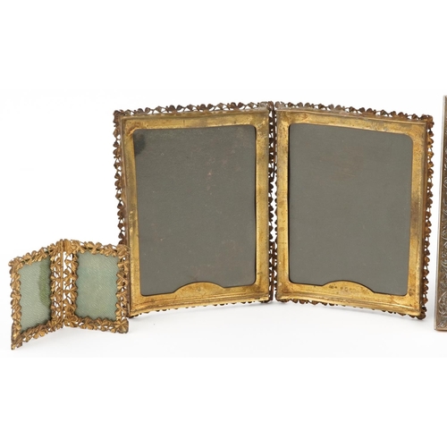 301 - Five vintage brass floral photo frames including clover folding examples, the largest 9cm high