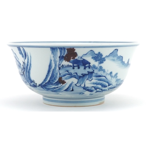 535 - Chinese blue and white with iron red porcelain bowl hand painted with figures in a river landscape, ... 