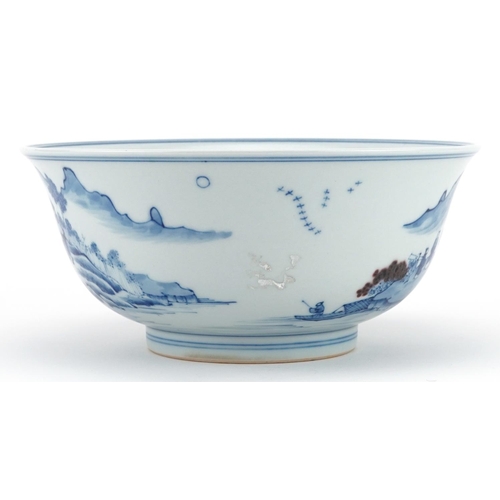 535 - Chinese blue and white with iron red porcelain bowl hand painted with figures in a river landscape, ... 