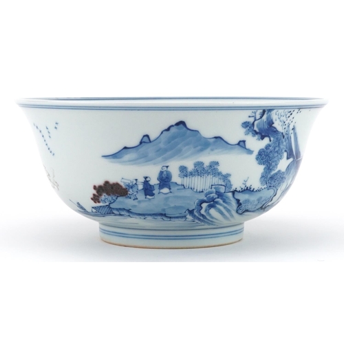 535 - Chinese blue and white with iron red porcelain bowl hand painted with figures in a river landscape, ... 