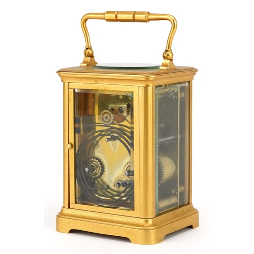 134 - Large French gilt brass carriage clock striking on a gong having circular enamelled dial with Roman ... 