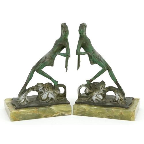 104 - Bruno Zach, pair of Austrian Art Deco verdigris bronze and onyx bookends in the form of scantily dre... 