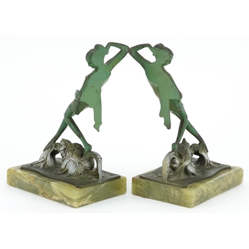 104 - Bruno Zach, pair of Austrian Art Deco verdigris bronze and onyx bookends in the form of scantily dre... 