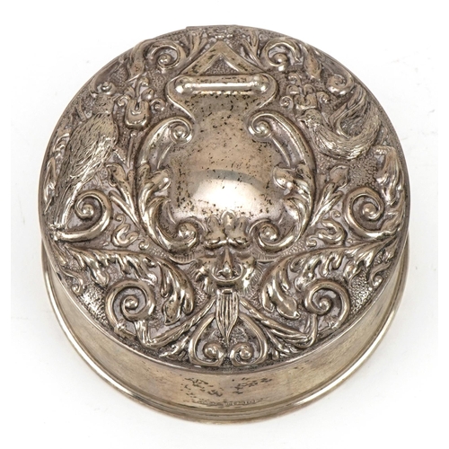 305 - W I Broadway & Co, Elizabeth II circular silver jewel box, the hinged lid embossed with birds amongs... 