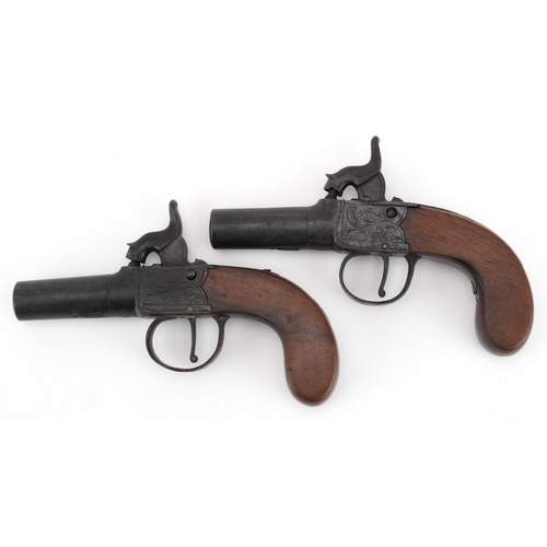 2513 - Pair of 19th century percussion muff pistols with engraved plates, housed in a fitted velvet lined b... 