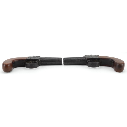 2513 - Pair of 19th century percussion muff pistols with engraved plates, housed in a fitted velvet lined b... 