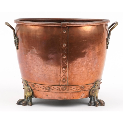 488 - Victorian copper and brass coal bucket with twin handles and three claw feet, 30cm high x 41cm wide