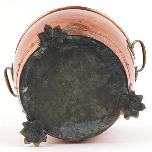 488 - Victorian copper and brass coal bucket with twin handles and three claw feet, 30cm high x 41cm wide