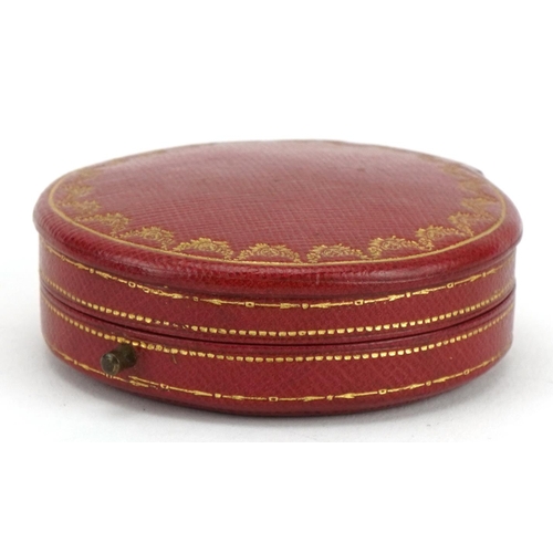 3013 - Cartier, vintage French tooled leather jeweller's box, 6.5cm in diameter