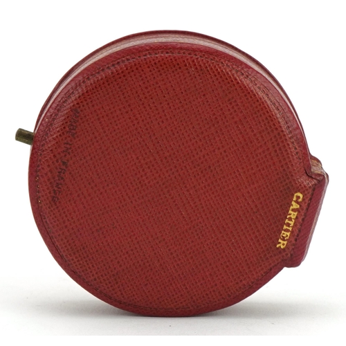 3013 - Cartier, vintage French tooled leather jeweller's box, 6.5cm in diameter