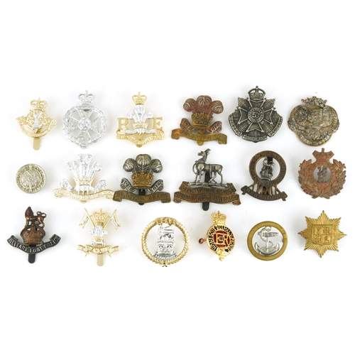 2417 - Military interest cap badges including Military Foot Police, Royal Monmouthshire and a Loyal Service... 