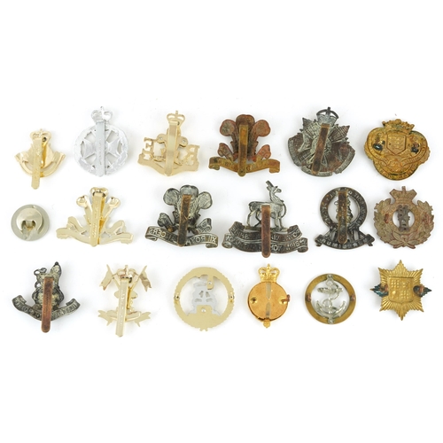 2417 - Military interest cap badges including Military Foot Police, Royal Monmouthshire and a Loyal Service... 