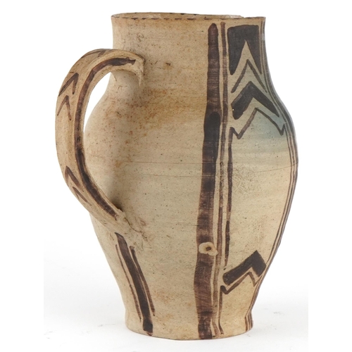 318 - Early Carter's Poole studio pottery jug hand painted with geometric design, 15.5cm high