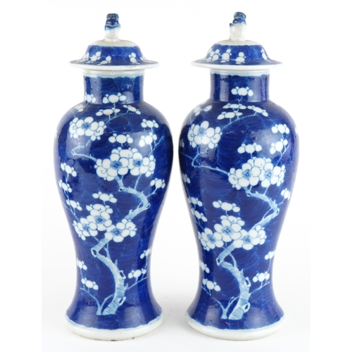 107 - Pair of Chinese blue and white porcelain baluster vases with covers hand painted in the prunus patte... 
