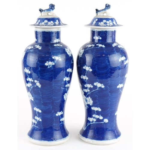 107 - Pair of Chinese blue and white porcelain baluster vases with covers hand painted in the prunus patte... 