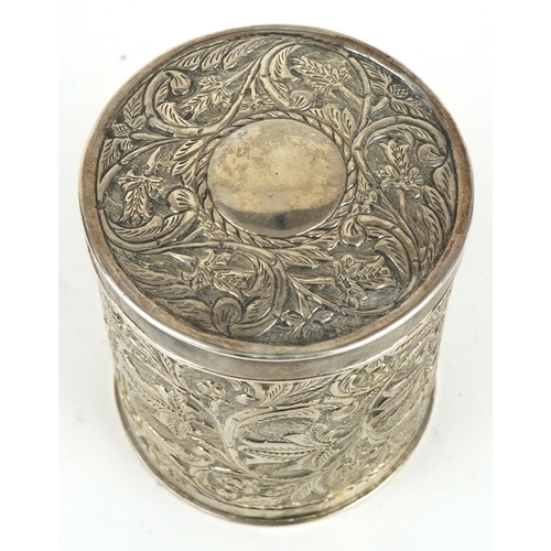 462 - Anglo Indian cylindrical box and cover profusely embossed with flowers and foliage, engraved from P ... 