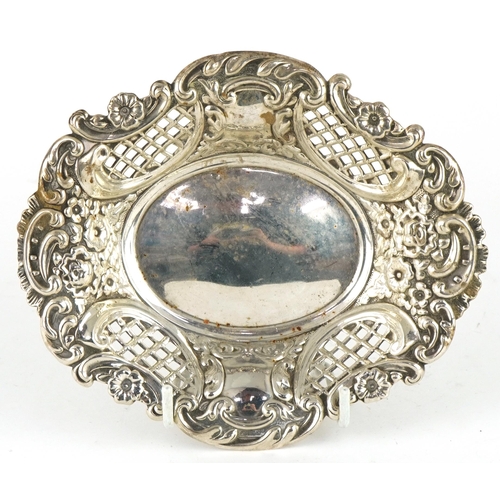 306 - Israel, Freeman & Son Ltd, Elizabeth II oval silver pierced bonbon dish embossed with flowers, Londo... 