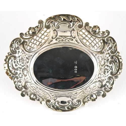 306 - Israel, Freeman & Son Ltd, Elizabeth II oval silver pierced bonbon dish embossed with flowers, Londo... 