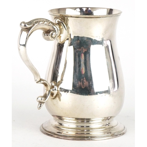 225 - Poston Products Ltd, Elizabeth II silver tankard with scrolled handle, Birmingham 1965, 13cm high, 3... 