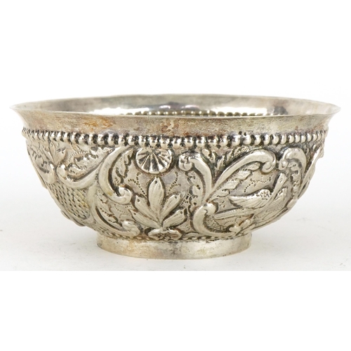 465 - Asian circular silver footed bowl embossed with birds amongst flowers and foliage, possibly Thai, 13... 