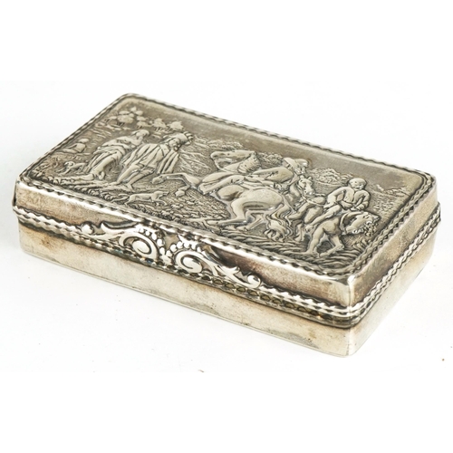 399 - Rectangular silver snuff box, the hinged lid embossed with figures on horseback and hounds, London i... 