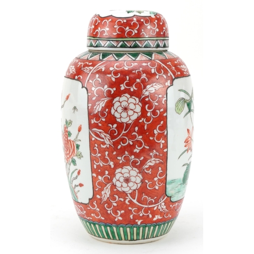 531 - Chinese porcelain iron red ground ginger jar with cover hand painted in the famille verte palette wi... 