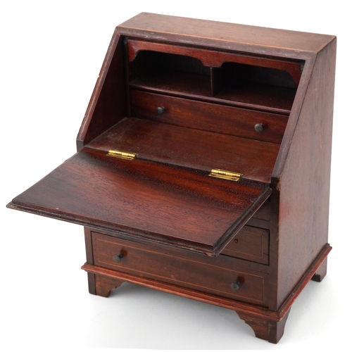 353 - Early 20th century inlaid mahogany apprentice bureau with fall above three drawers, 30cm H x 24cm W ... 