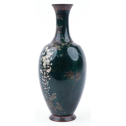 115 - Large Japanese green ground cloisonne vase enamelled with a bird amongst wisteria, 44cm high