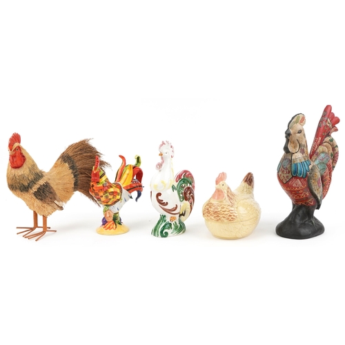 2371 - Five decorative chickens including a pottery egg basket and cover, straw work example and one hand p... 