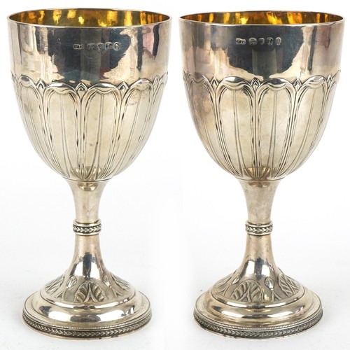 53 - Thomas Daniell, pair of George III silver goblets embossed with stylised leaves and gilt interiors, ... 