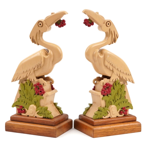 2376 - Pair of Art Deco hand painted oak stylised bird sculptures, each 25cm high