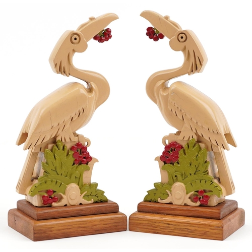 2376 - Pair of Art Deco hand painted oak stylised bird sculptures, each 25cm high