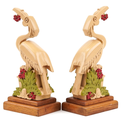 2376 - Pair of Art Deco hand painted oak stylised bird sculptures, each 25cm high