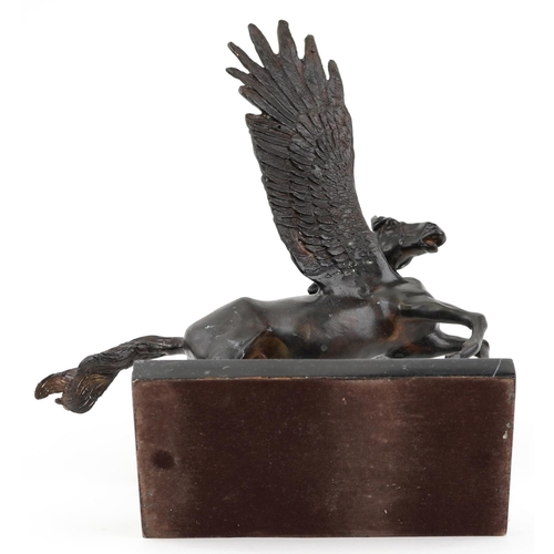 208 - Classical patinated bronze sculpture of Pegasus raised on a rectangular black marble base, 30.5cm wi... 