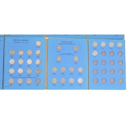 2586 - Three Great Britain coin collection folders with various coins comprising three pence silver, sixpen... 