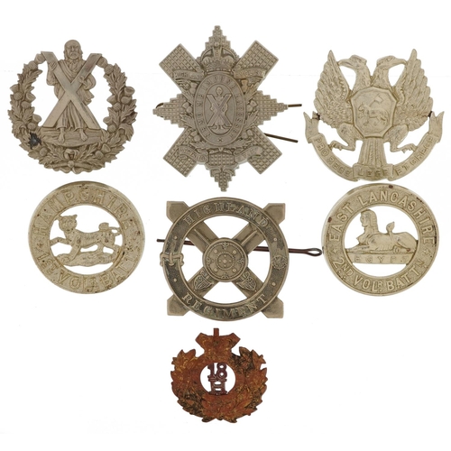 2426 - Seven military interest cap badges including Highland Regiments, Hampshire 1st Volunteer Battalion a... 